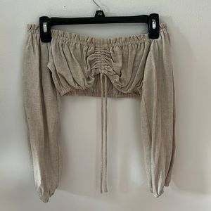 A super cute off the shoulder too. A tan color. Size small.